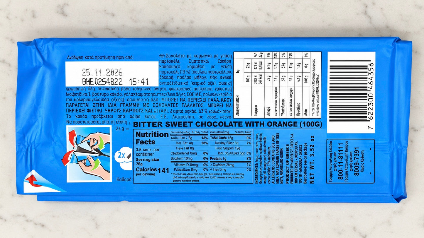 Blue chocolate bar packaging with nutritional information on a marble surface