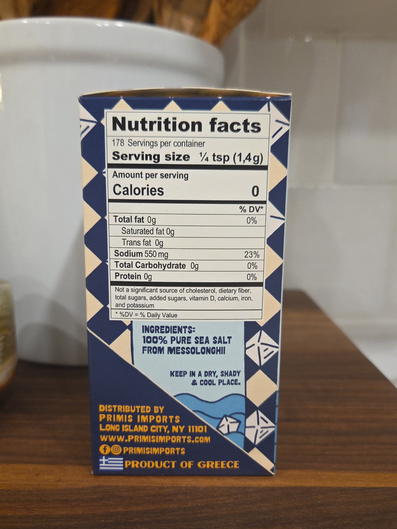 Nutrition facts label on a small container with a geometric design