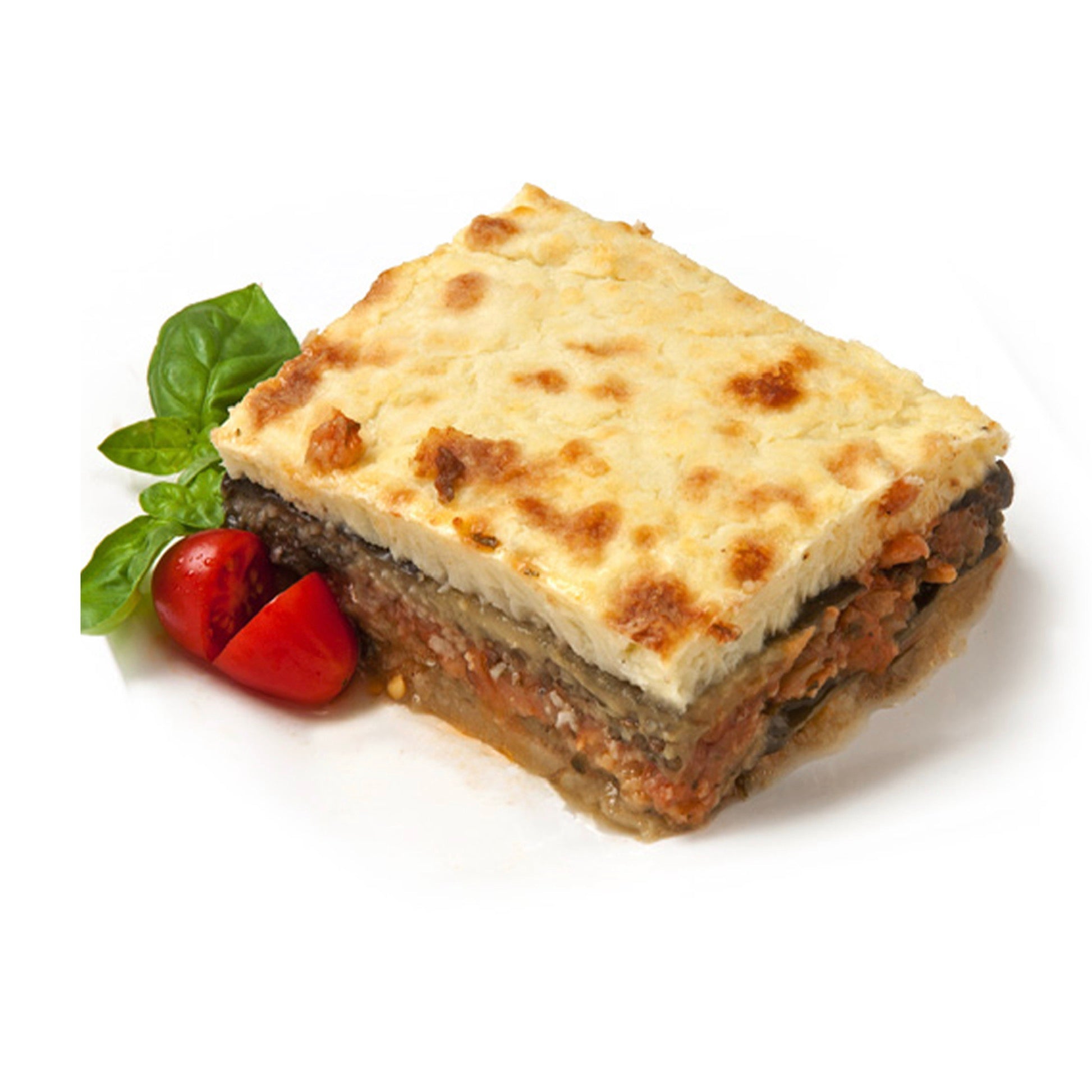 Square piece of lasagna with a tomato and basil leaf on a white background
